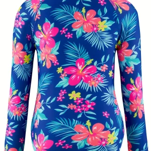 Enfant portant maillot de bain fleuri manches longues UV
