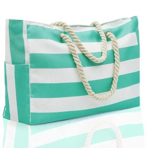 Grand sac de plage Vita coloré posé sur le sable